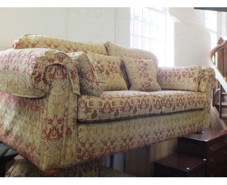 A Multiyork three piece suite in gold and terracotta comprising a three seat sofa, chair and foot stool