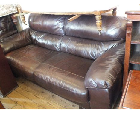 A three seat brown leather sofa