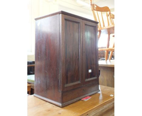 A small mahogany two door cabinet with a single drawer