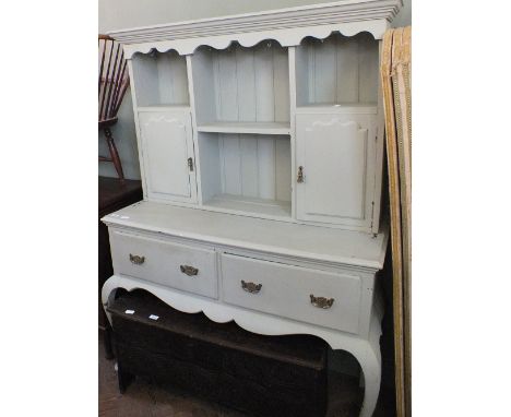 A pale green painted oak shelf back cupboard with two drawers on cabriole legs