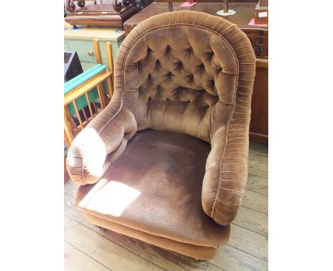 A Victorian armchair in button back brown draylon