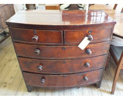 A Victorian mahogany bow front chest of two short and three long drawers on bracket feet