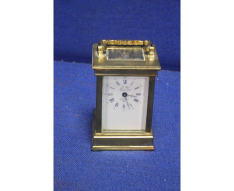 A BRASS FRENCH MAID CARRIAGE CLOCK
