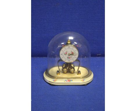 A KERN GLASS DOMED MANTLE CLOCK