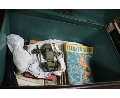 A TIN TRUNK CONTAINING DINKY MILITARY VEHICLES, MAGAZINES ETC 