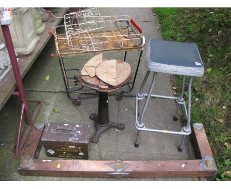 A Victorian cast iron stool on lions paw feet, a two tier steel rack, decorative Canterbury, etc.