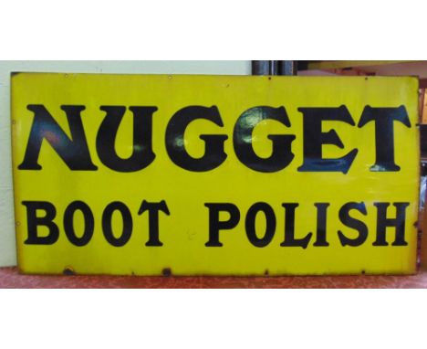 A period enamel advertising sign "Nugget Boot Polish" with black text on a yellow ground, 62 x 122 cm approx.