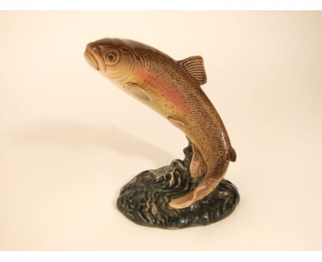 A Beswick model of a leaping trout with impressed and printed marks to base 1032
