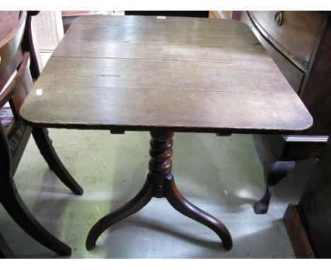 A 19th century oak snap top occasional table, the rectangular boarded top raised on a central turned pillar and shaped tripod