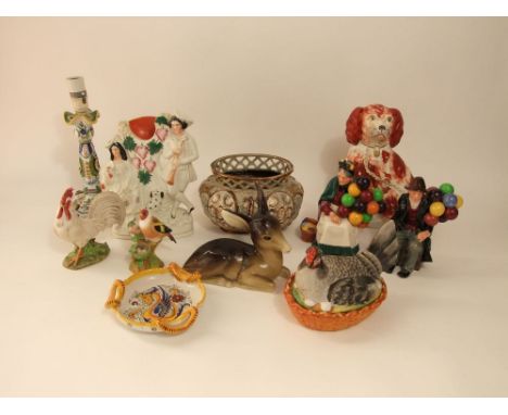 A pair of Royal Doulton figures, The Old Balloon Seller HN1315 and The Balloon Man HN1954, a 19th century Staffordshire red a