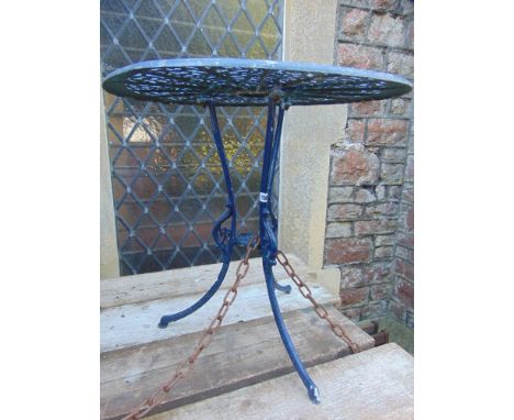 An aluminium garden table of circular form with pierced top on tripod base.