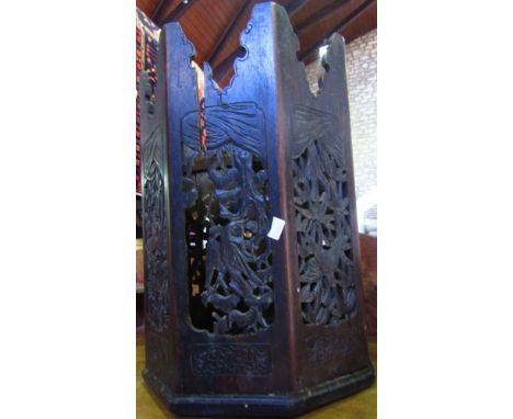 1970 mahogany waterfall wall shelf, 57cm high; together with an Eastern fold table pierced with birds amidst foliage (2)