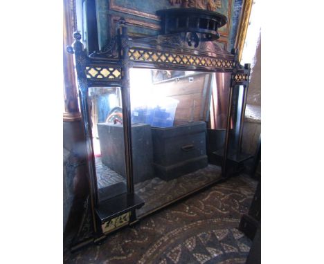 An aesthetic movement over mantle mirror containing three mirror plates within a black and gilded framework together with a d