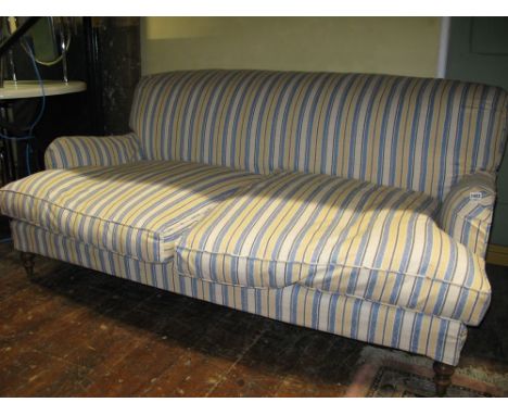 A good quality Howard style low slung deep seated 2-3 seat sofa with shaped outline, alternating striped upholstery and loose