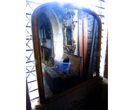 A substantial Victorian arched over mantle mirror, the frame with moulded and rope twist detail, 135 cm high approx.