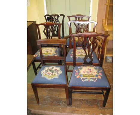 Seven (6 + 1) Georgian mahogany dining chairs, five in the Chippendale style with pierced Gothic tracery splats, all with wel