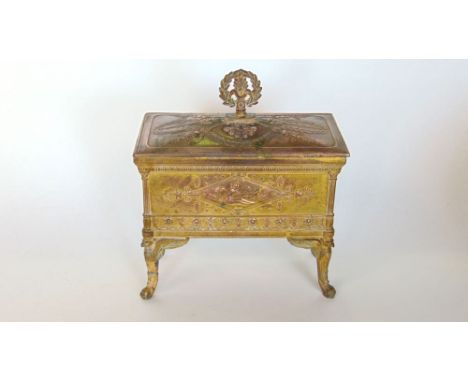 An attractive embossed copper jewellery casket, the hinged lid enclosing a fitted interior with panels of nudes and floral ge