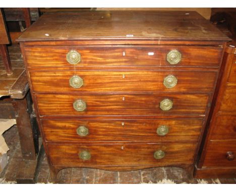 An early 19th century mahogany secretaire chest of four long graduated drawers, the secretaire with patent brass push button 