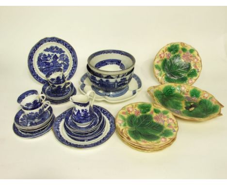 A collection of early 20th century Wedgwood majolica dessert wares with fruiting vine decoration on a pale yellow ground comp