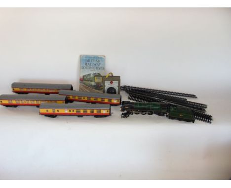 Hornby Britannia engine together with four associated carriages and a small selection of track, with a Ladybird Book of Briti