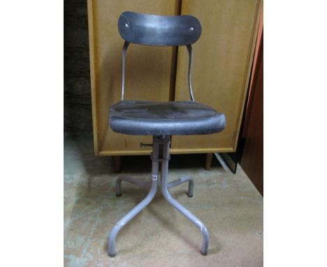 A vintage industrial machinist engineer's stool upon a tubular steel frame, 87 cm high approx.