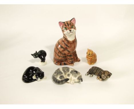 A collection of ceramic cats including Goebel example in the form of an arched back black cat, a Price Kensington model of a 