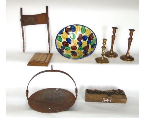 A Georgian brass candlestick with knopped stem, a further pair of candlesticks, an old wrought iron boot scraper, iron girdle