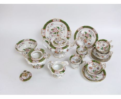 A collection of mid 19th century tea wares with green and gilt borders and printed and infilled floral decoration in the Rock