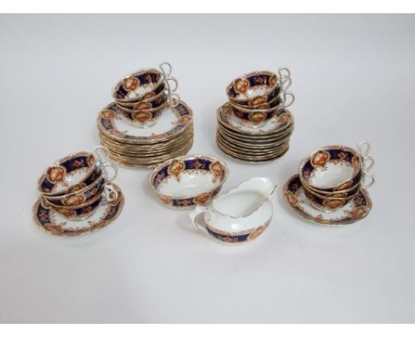 A collection of Royal Albert Crown China tea ware comprising milk jug, sugar bowl, twelve cups, twelve saucers and twelve tea