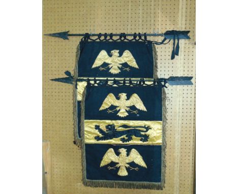 A pair of crested gold thread upholstered panels decorated with eagles and panthers with wrought iron arrow brackets (2).