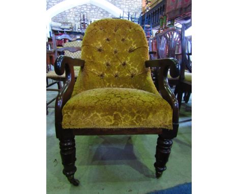 A Victorian button back drawing room chair on turned supports