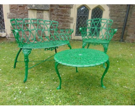 A painted aluminium garden terrace bench, further matching armchair and a circular table.