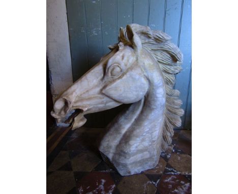 A carved alabaster life sized model of a horse's head with flowing mane, 65 cm tall approx.