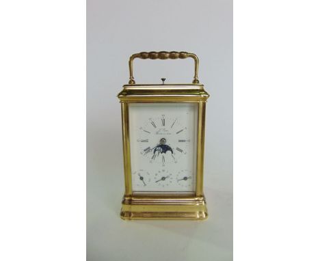 L'Epee repeating brass carriage clock with white enamel dial with subsidiary seconds, subsidiary phases of the moon dial and 