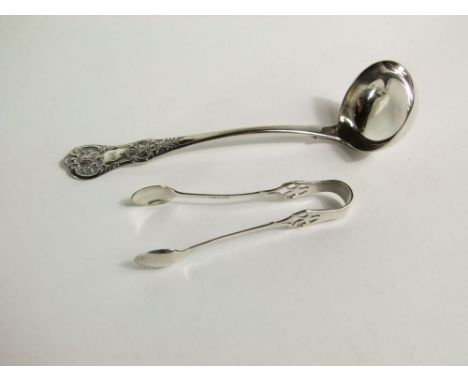 An Irish silver fiddle and shell pattern ladle Dublin 1852 and a pair of silver sugar nips, 2 oz