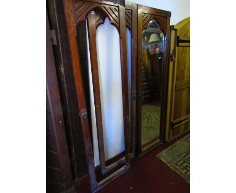 Three Victorian pitch pine doors with original fittings, one enclosing a bevelled edged mirror plate.