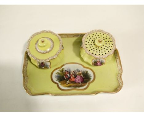 A 19th century Meissen desk set of rectangular form (28cm long) with reserved gilded cartouche containing Watteauesque dancin