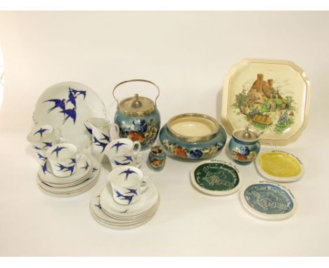 Art deco ceramics with printed pansy decoration on a blue ground and plated mounts and covers comprising a biscuit barrel, a 