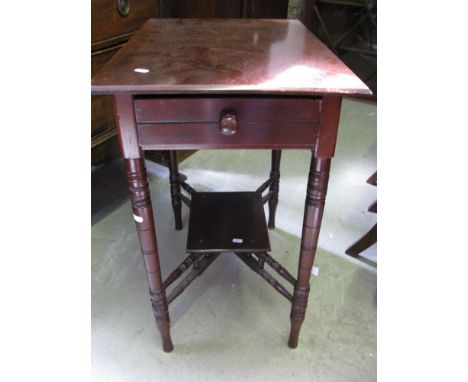 An Edwardian mahogany occasional table of rectangular form with end frieze drawer, raised on four ring turned bobbin legs uni