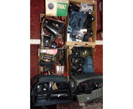 A very large quantity of photographic and camera equipment to include many cameras and lenses, etc