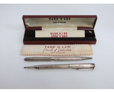 Two silver yard - o - led propelling pencils with engine turned details in a single case