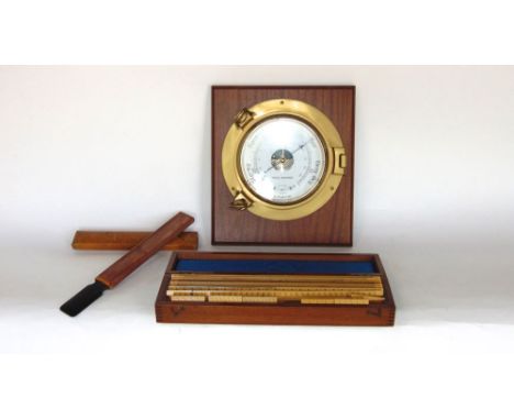 Brass ships barometer fitted on a mahogany plinth together with a further boxed set of rulers and a further suede brush (3)