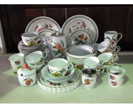 A collection of Royal Worcester Evesham pattern oven to table wares including a coffee pot, cups and saucers, preserve pot an