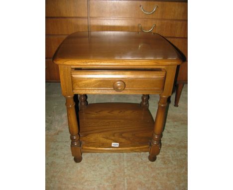 An Ercol Golden Dawn bedside/pedestal table fitted with a single slim drawer and under tier, 55 cm high approx.