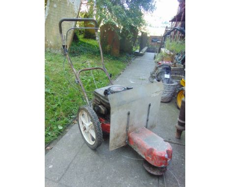 A petrol driven single axle rotary strimmer with Briggs & Stratton engine.