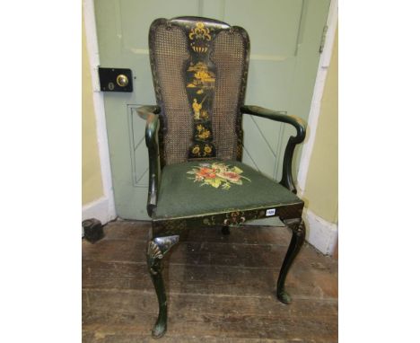 A late 19th century chinoiserie elbow chair principally in a green lacquered colourway with gilded detail, with cane panelled