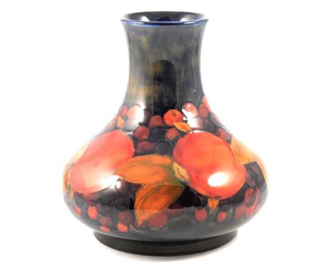 William Moorcroft, a 'Pomegranate' vase, circa 1920, squat form, signed in green, stamped 'Moorcroft Made in England', 20.5cm