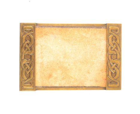 Glasgow School Arts and Crafts brass desk blotter, designed by Margaret Gilmour, circa 1900, the end panels embossed with Cel