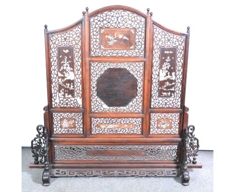 Chinese hardwood screen, three panels with arched centre section, pierced scroll ground with decorated mother-of-pearl inlaid