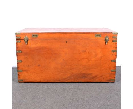 Large teak campaign trunk, rectangular form with brass corners and carrying handles, 127x65cm, height 66cm.